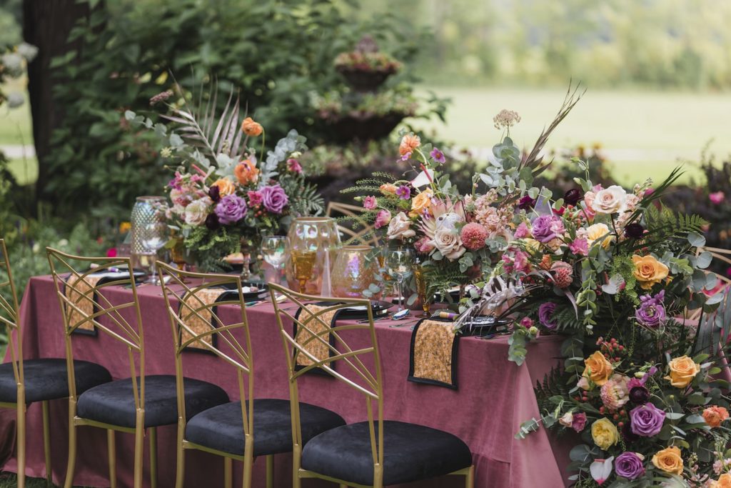 Magical summer garden wedding tablescape with grand florals