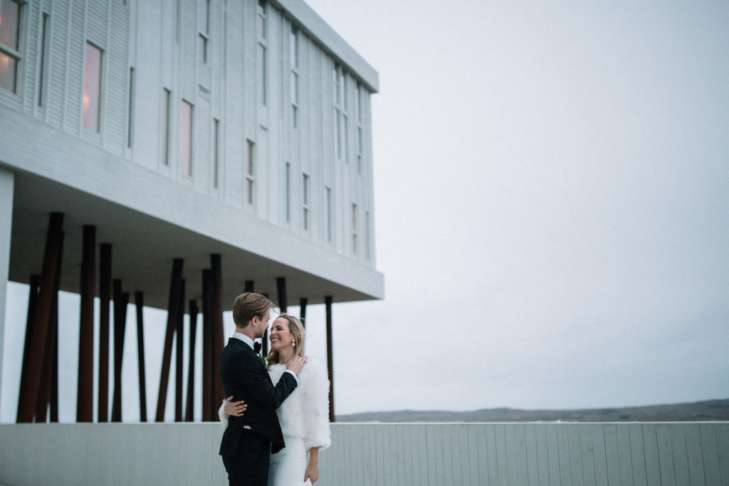 bride and groom pose for portrait at Fogo Island Inn