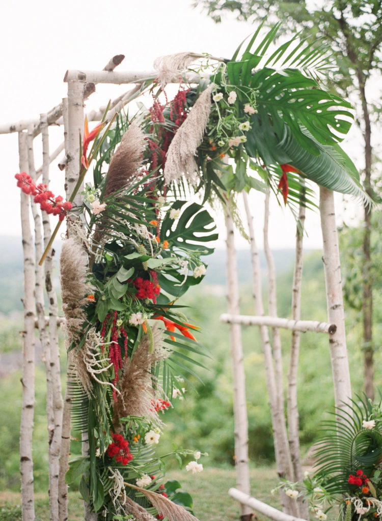 tropical wedding arch with exotic flowers