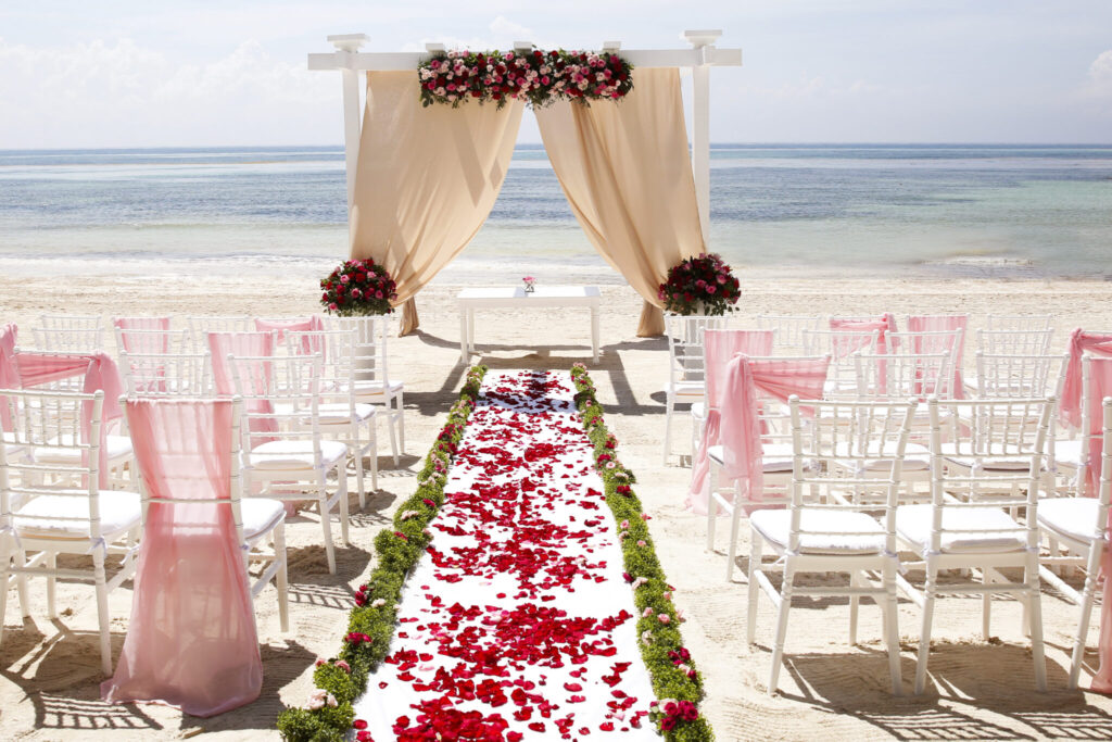 beautiful beach wedding aisle by destination wedding planning gurus Weddings by Palladium