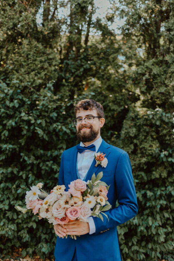 groom with a bouquet