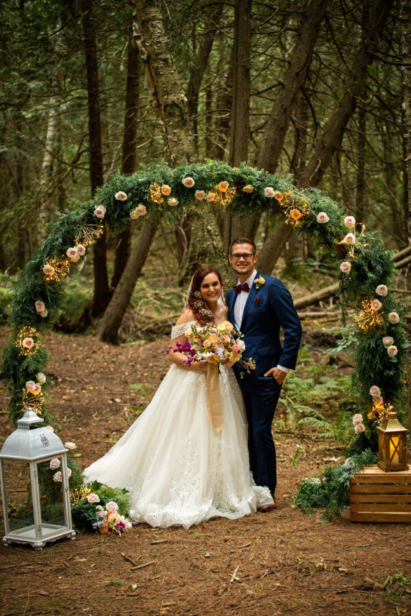 outdoor wedding arch bride and groom