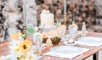 Wedding reception table with yellow flowers.