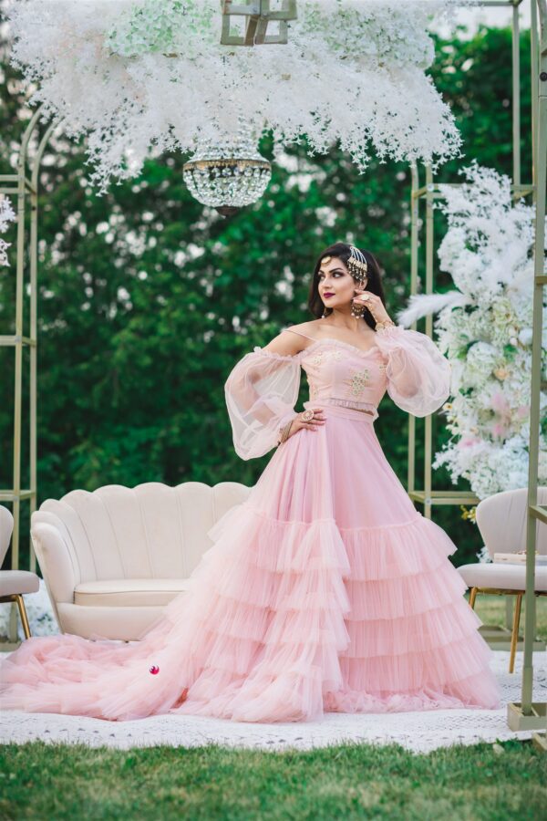 Gorgeous bride wearing pink wedding dress with puffy sleeves