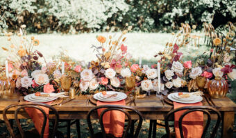 beautifully vibrant fall wedding decor and table setup. fall wedding flowers with subdued and pops of colour