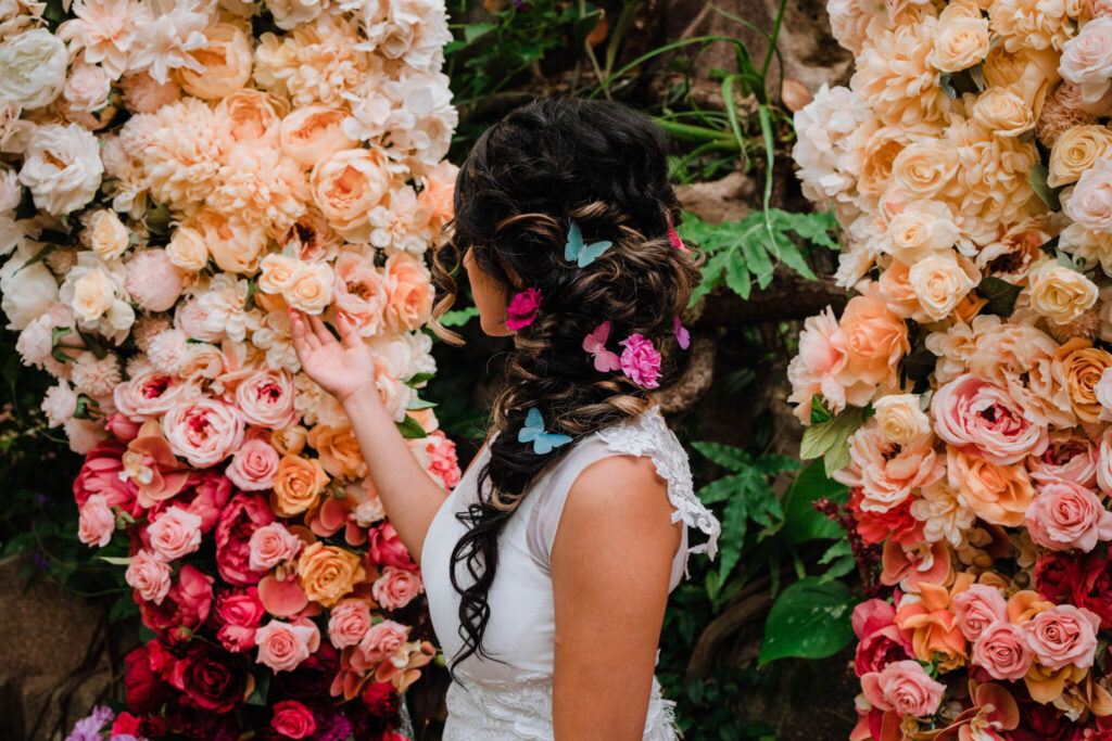 Grand butterfly wedding floral installation at summer garden wedding party