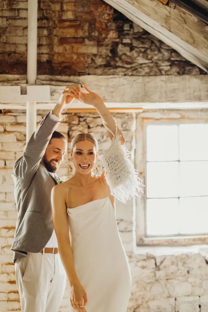 bride and groom dancing minimalist wedding dresses 