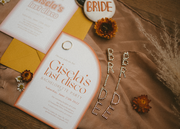 themes for bachelorette parties - flatlay photo of invitation to a disco bachelorette themed party