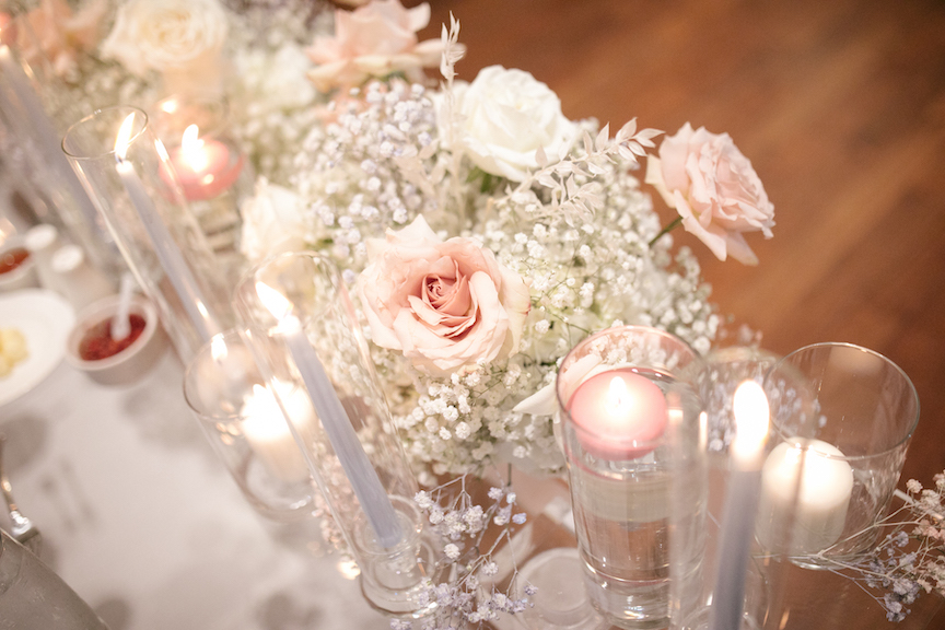 pink flowers with candles 