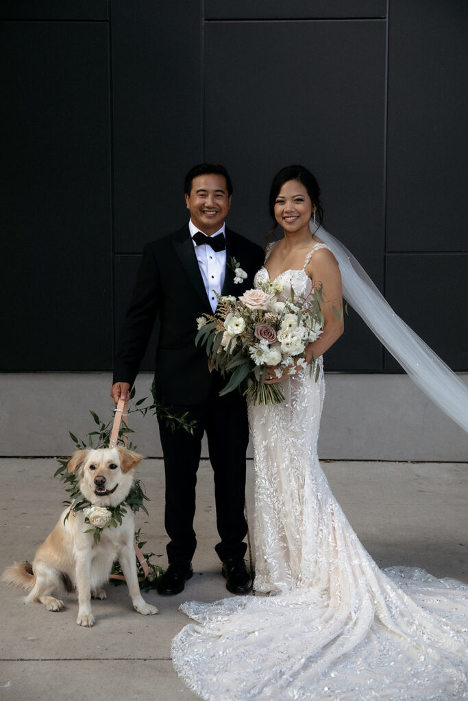 happy couple at the wedding with dog