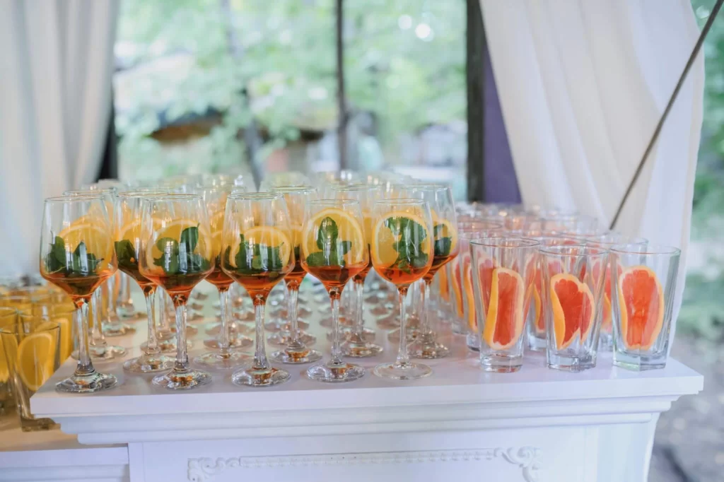 table with wedding signature drinks lined up for wedding guests