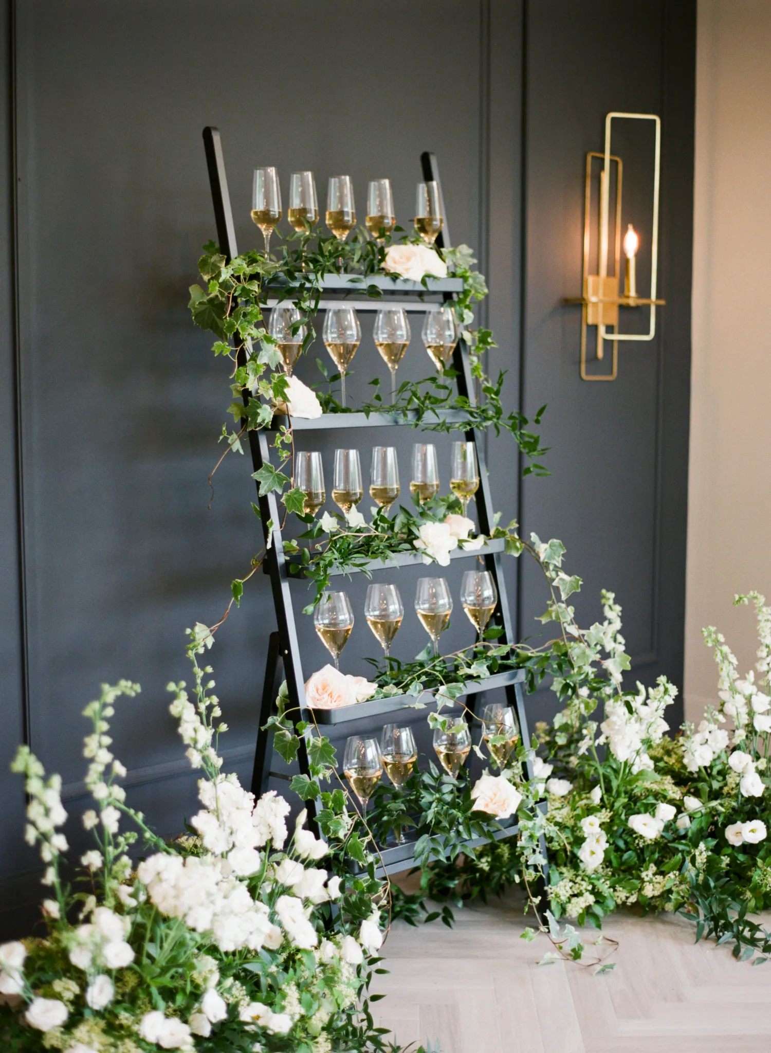 beautiful vintage shelves for champagne glasses at garden wedding