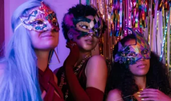3 ladies at masquerade ball engagement party