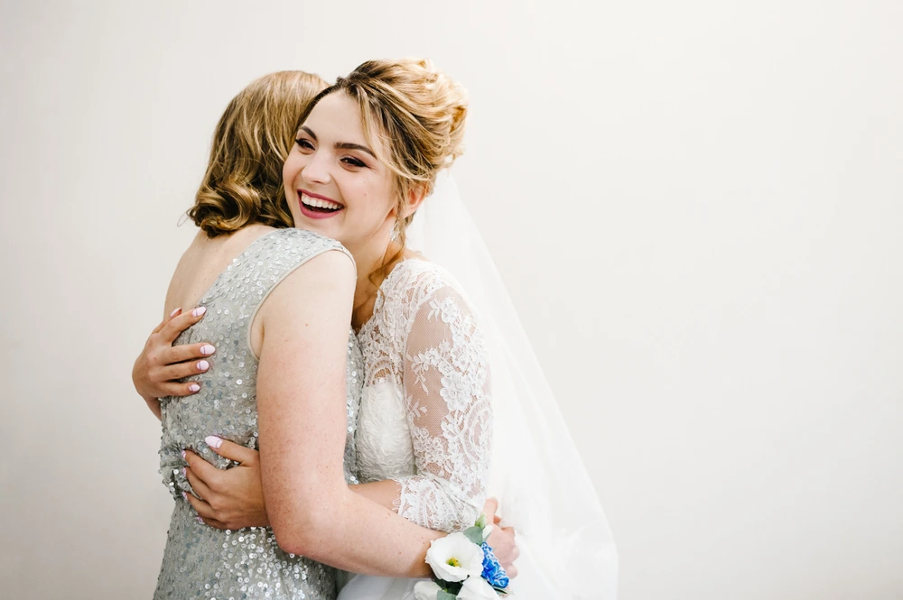 Special wedding moments between mother and daughter captured on film - the first embrace after the ceremony