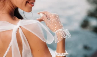 picture of bride wearing short hand gloves with polka dot details