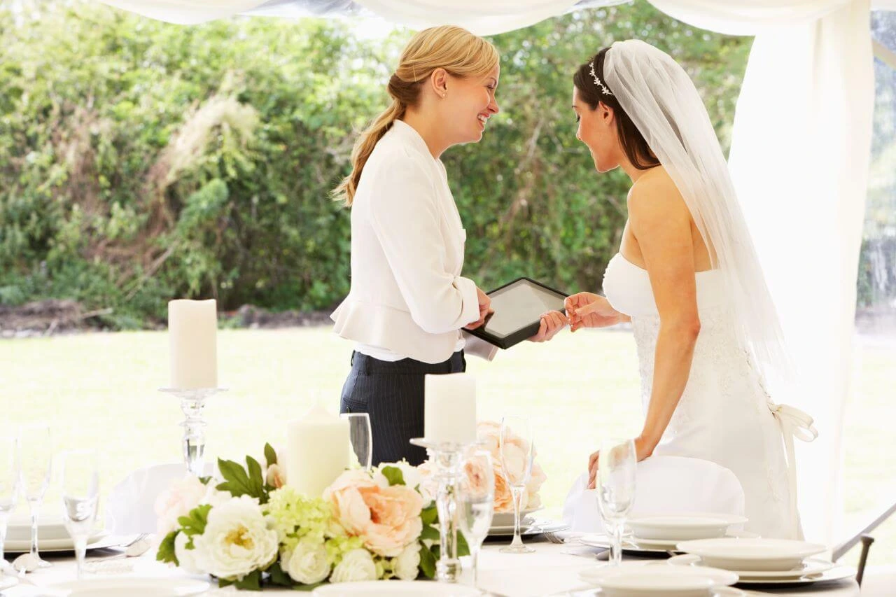 bride questions wedding planner at reception