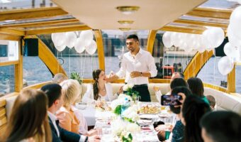 gentleman giving wedding speeches on a boat