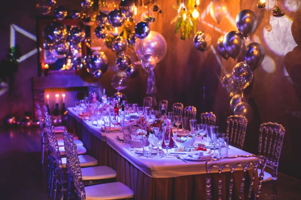 nighttime engagement party table with balloons for a festive event