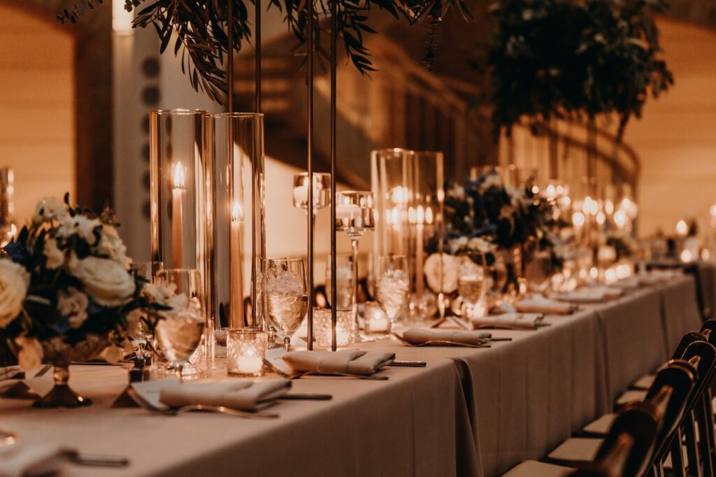beautiful dark and moody wedding photography style capturing candlelit wedding reception table