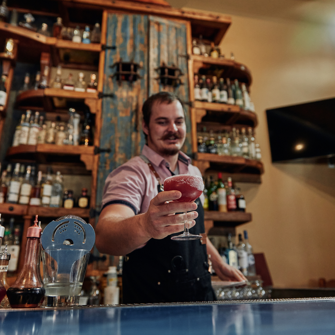 bartender serving unique cocktail at Fish Gaucho in Paso Robles