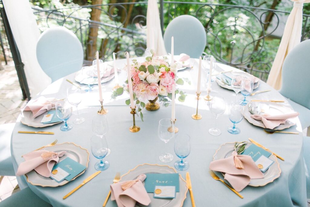 romantic round wedding table with vintage blue and blush wedding colour palette