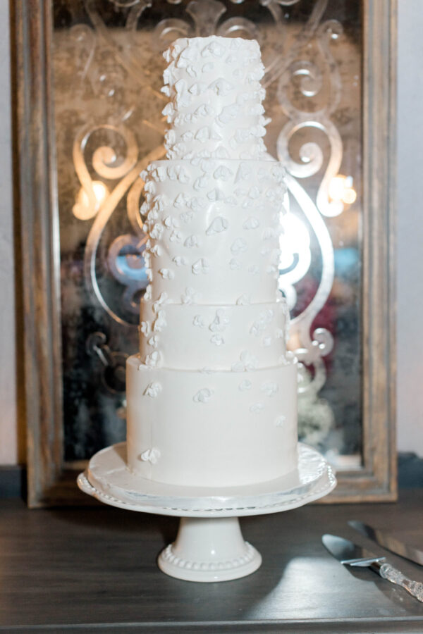 a white cake on a stand