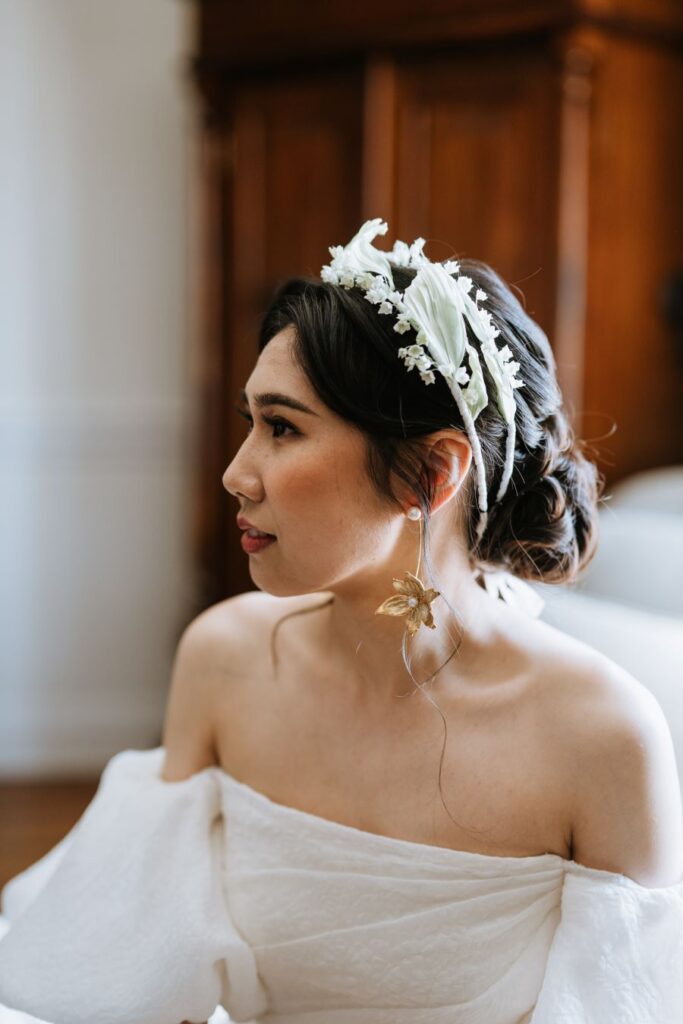 Beautiful bride in white dress and crown