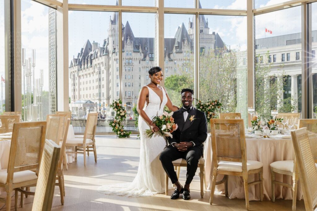 stunning photo of bride and groom at modern wedding at the National Arts Centre Ottawa floor to ceiling window backdrop for bride and groom portrait