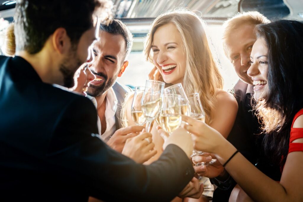 people celebrating at engagement party games clicking champagne glasses