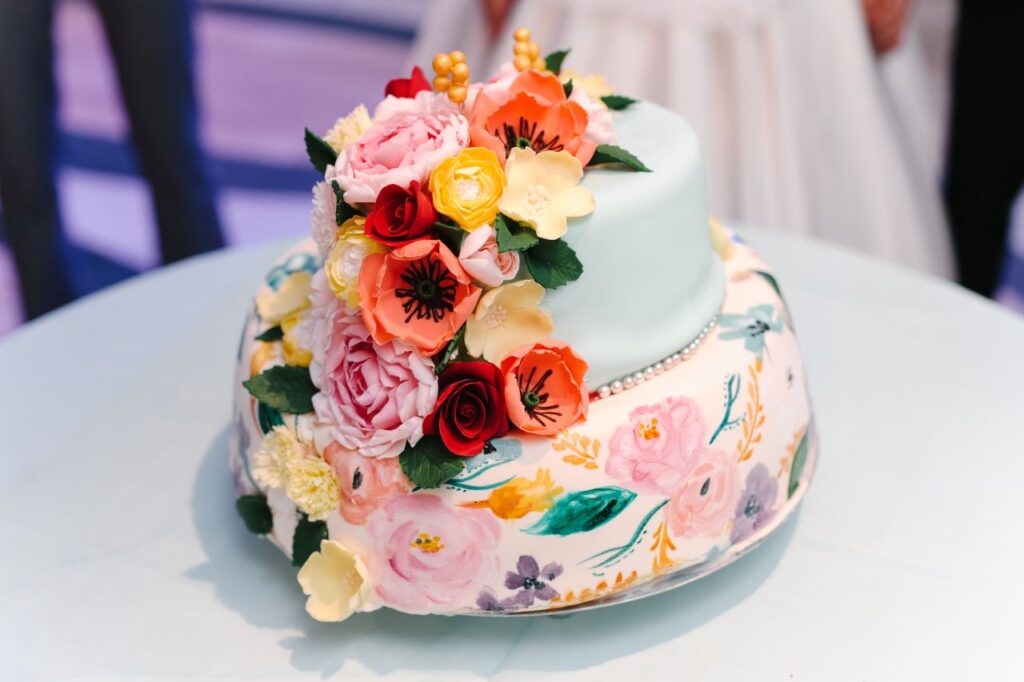 beautiful flowers painted on wedding cake a hot 2024 wedding trends