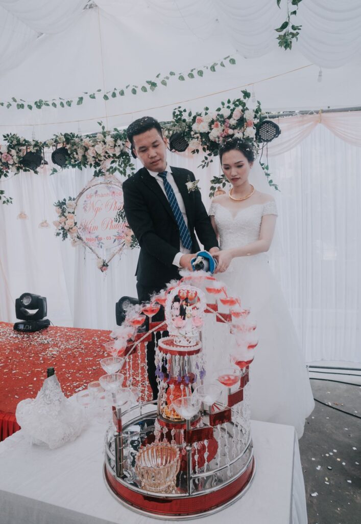 Bride and groom sharing their first slice of cake as a married couple.