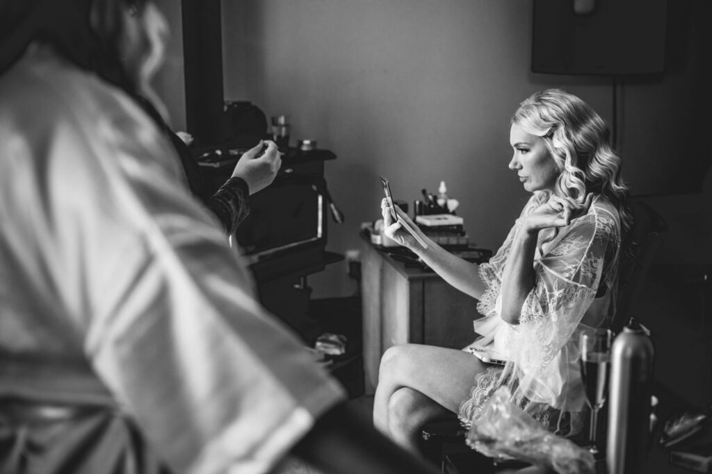beautiful black and white photo of Stefanie getting ready for wedding at Viamede Resort, Stony Lake 