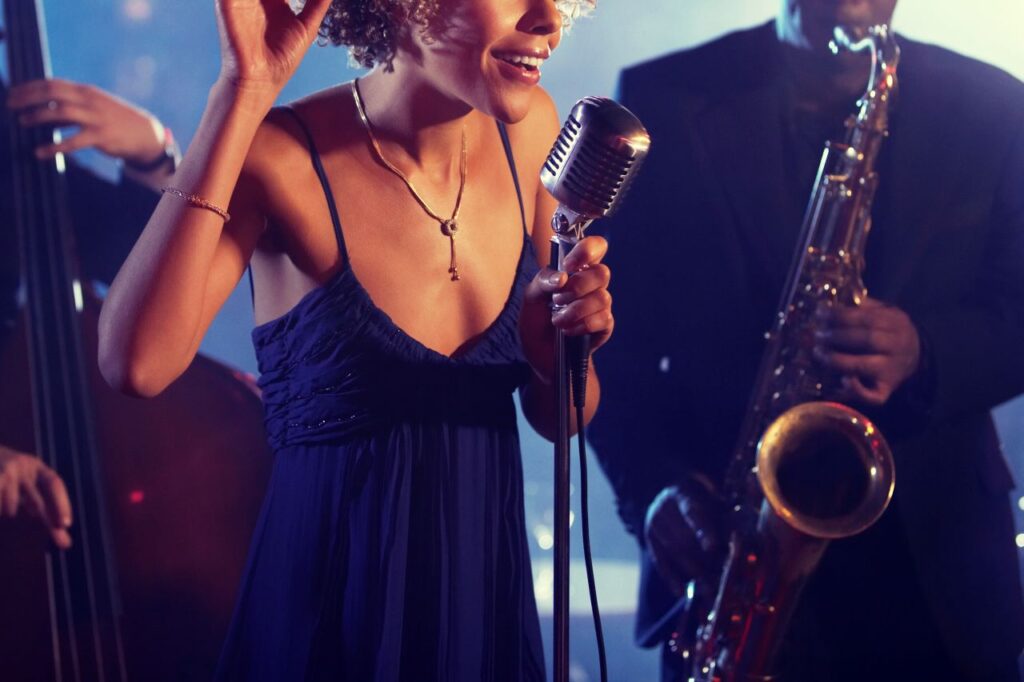 woman singing in jazz band as wedding entertainment at reception