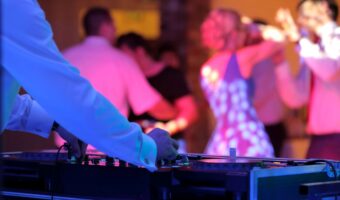 wedding DJ spins tunes while everyone hits the dancefloor