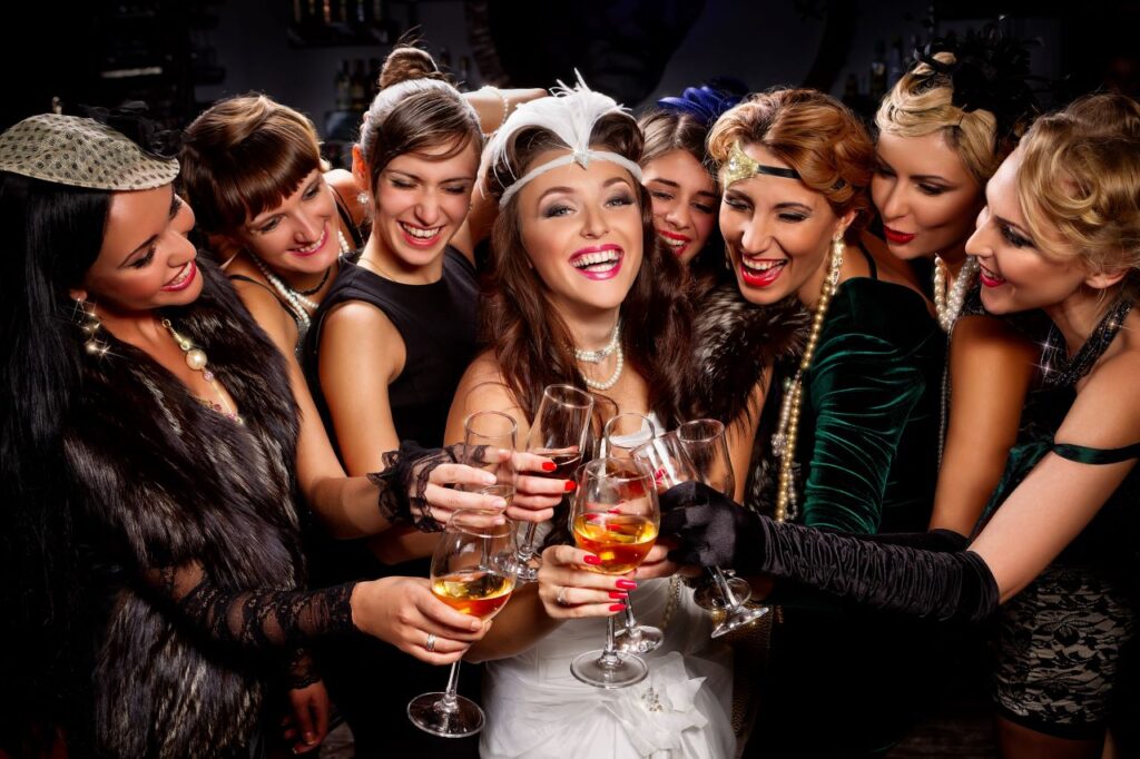 group of young women drinking champagne during Great Gatsby bachelorette party