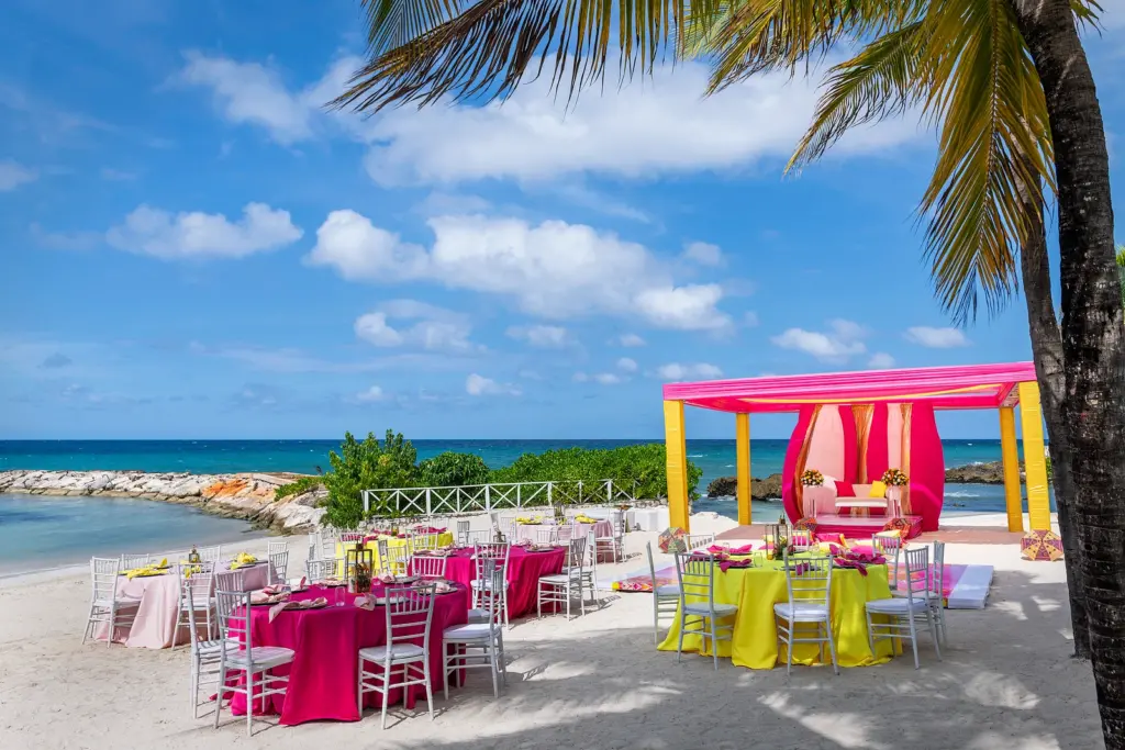 hot pink and yellow seaside wedding at Grand Palladium's Jamaica resort
