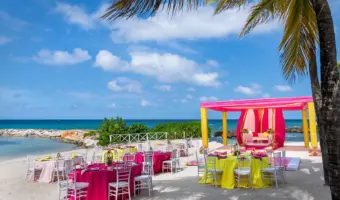 hot pink and yellow seaside wedding at Grand Palladium's Jamaica resort