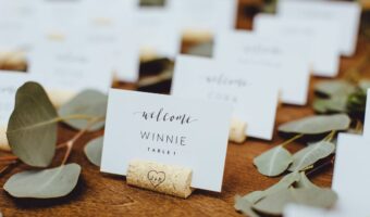 Table with wedding place cards in wine cork holders