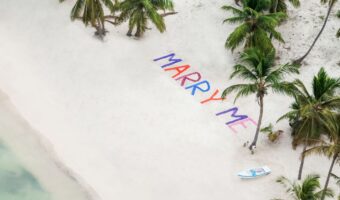 best way to propose in Punta Cana helicopter ride with marry me spelled out in sand below