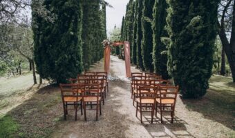 beautiful outdoor wedding ceremony for summer weddings in Tuscany cyprus trees