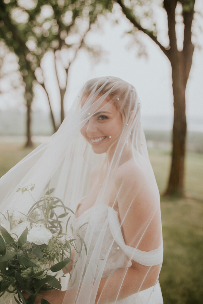 beautiful portrait of bride Sarah wearing drop veil at Saskatchewan destination wedding