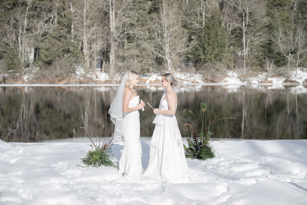 winter wedding elopement in Muskoka two brides Muskoka elopement in the snow on the river