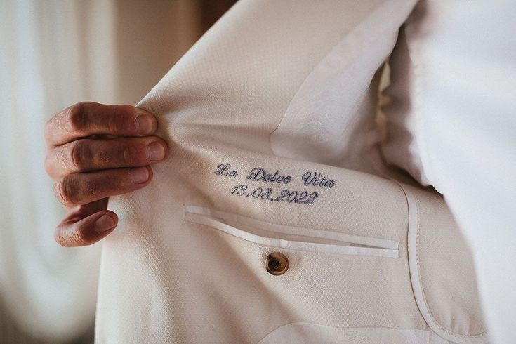 embroidered love note inside groom jacket, a hot groom destination wedding trends