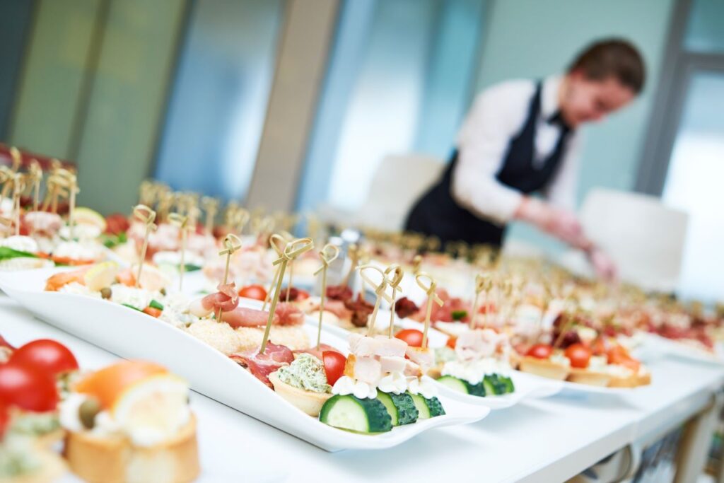 Caterer plating summer wedding food wedding vendors serving food with dietary restrictions at weddings