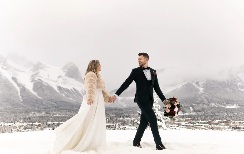 An intimate winter wedding in Canmore, featuring a couple surrounded by breathtaking natural scenery.