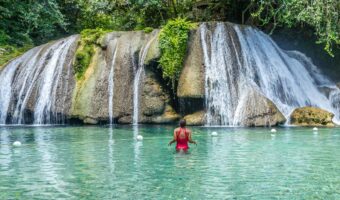 Woman admiring Reach Falls on Jamaica honeymoon