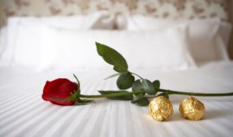 chocolates on hotel pillow for wedding guests turndown service