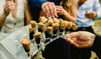 guests enjoyin mini waffle cones late-night wedding snacks