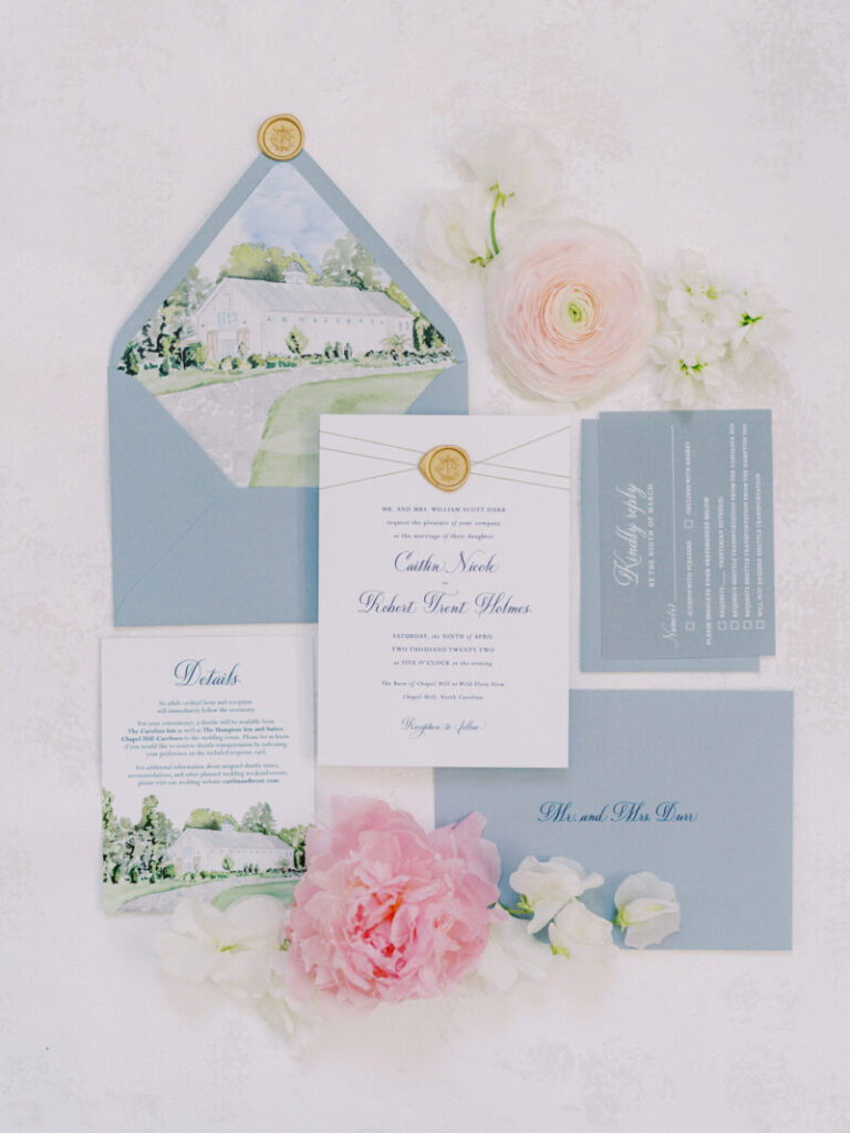 romantic blue wedding invitation suite flatlay