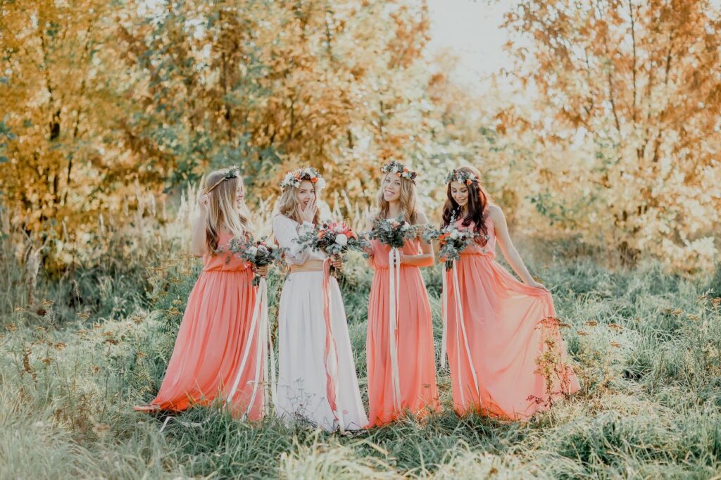 beautiful bridesmaids wearing coral bridesmaid dress colors